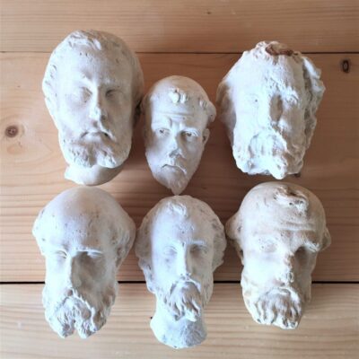 Monk-heads-head-shaped-plaster-sculptures